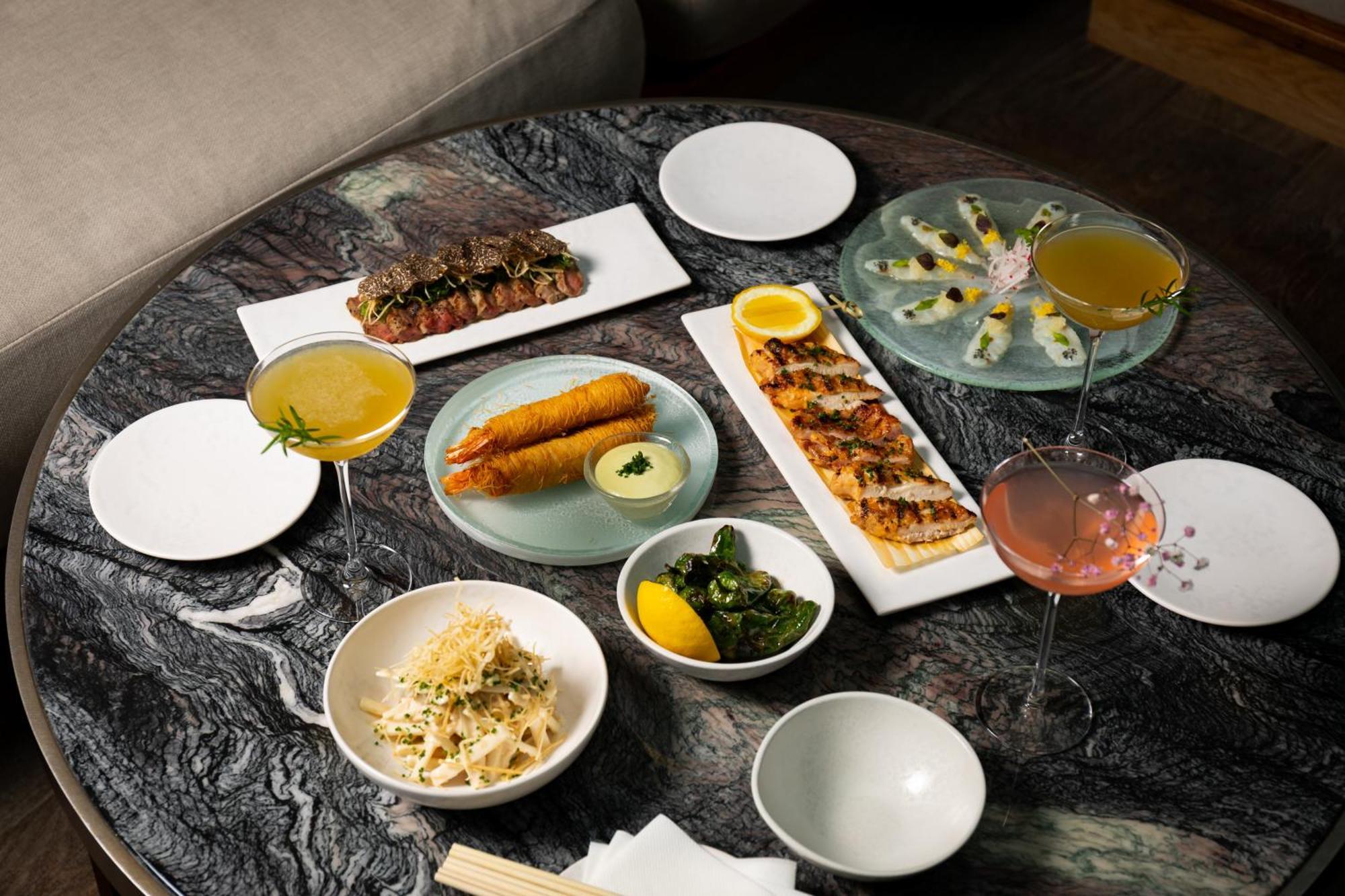 Hotel The Londoner Zewnętrze zdjęcie A selection of dishes at the restaurant